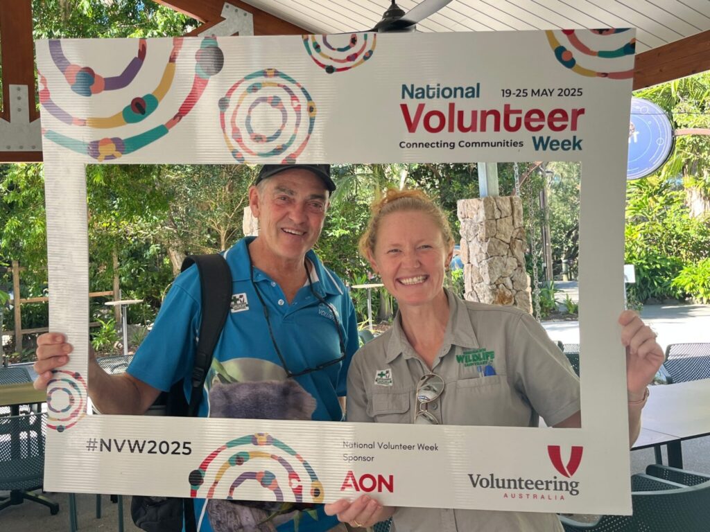 Gayle with a volunteer holding a National Volunteer Week Frame