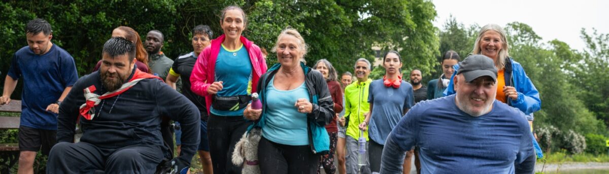 diverse community group running together