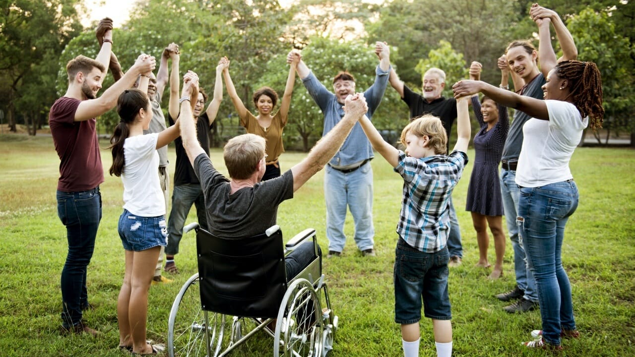 Image of Volunteers joining in together